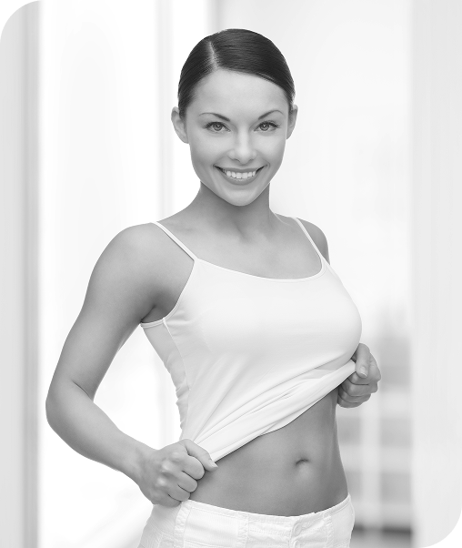 a woman in white shirt after mommy makeover surgery